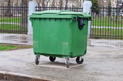 Household waste being loaded into a skip in Greenwich